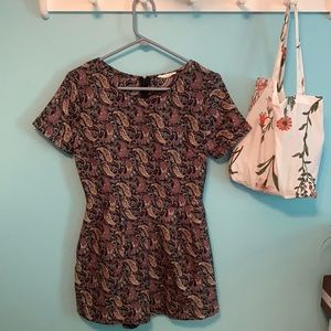 Patterned romper with navy blue base color